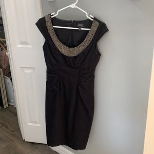 Knee length black dress with silver bead work. Perfect condition.